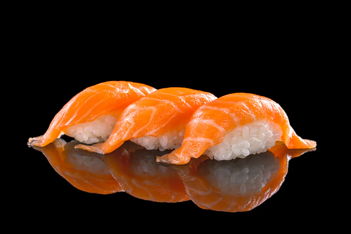 Fresh salmon nigiri sushi with vinegared rice at Chop Asian Kitchen, a Asian Fusion Restaurant in Amityville